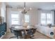 Dining area features modern lighting, stylish furniture, and an open floor plan at 14042 Aikenwood Dr, Charlotte, NC 28278