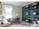 Home office featuring a large desk, built-in shelves, and a comfortable workspace at 14042 Aikenwood Dr, Charlotte, NC 28278