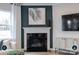 Living room has an elegant fireplace, TV, and contemporary furnishings for relaxation at 14042 Aikenwood Dr, Charlotte, NC 28278