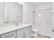 Modern gray vanity, white quartz countertop, and a bathtub at 1535 Solitude Ct, Kannapolis, NC 28081