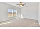 Well-lit bedroom with carpet and large windows at 1535 Solitude Ct, Kannapolis, NC 28081