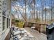 Deck with seating area, grill, and wooded views at 17628 Cambridge Grove Dr, Huntersville, NC 28078