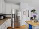 Stainless steel refrigerator and pantry in spacious kitchen at 17628 Cambridge Grove Dr, Huntersville, NC 28078