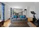 Spacious living room with gray sofa and hardwood floors at 17628 Cambridge Grove Dr, Huntersville, NC 28078