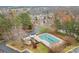 Aerial view of community pool, surrounding homes, and landscaping at 2022 University Heights Ln, Charlotte, NC 28213