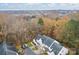 Aerial view of townhome and surrounding wooded area at 2022 University Heights Ln, Charlotte, NC 28213