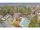 Aerial view showing community pool, homes, and parking areas at 2022 University Heights Ln, Charlotte, NC 28213