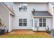 Small patio and backyard with autumn leaves at 2022 University Heights Ln, Charlotte, NC 28213