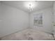 Bright dining room with chandelier and window at 2022 University Heights Ln, Charlotte, NC 28213