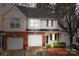 Two-story townhouse featuring a brick facade and attached garage at 2022 University Heights Ln, Charlotte, NC 28213