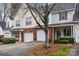 Brick front townhouse with attached garage and landscaping at 2022 University Heights Ln, Charlotte, NC 28213