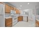 Spacious kitchen with white appliances and oak cabinets at 2022 University Heights Ln, Charlotte, NC 28213