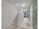 Stairs leading to upper level and entry to exterior at 2022 University Heights Ln, Charlotte, NC 28213