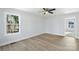 Bright bedroom with wood-look floors and ceiling fan at 25 Kesler St, Salisbury, NC 28144