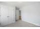 Simple bedroom with double door closet and carpeting at 25 Kesler St, Salisbury, NC 28144