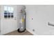 Laundry area with a water heater and shelving at 25 Kesler St, Salisbury, NC 28144