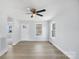 Bright and airy living room with laminate floors and a ceiling fan at 25 Kesler St, Salisbury, NC 28144