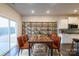 Kitchen dining area with rustic wood table and industrial-style shelving at 3064 Virginia Trail Ct, Fort Mill, SC 29715