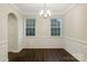 Bright dining room with wainscoting and hardwood floors at 3064 Virginia Trail Ct, Fort Mill, SC 29715