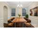 Formal dining room with rustic wood table and chandelier at 3064 Virginia Trail Ct, Fort Mill, SC 29715