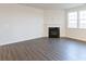 Living room with corner fireplace and hardwood floors at 3064 Virginia Trail Ct, Fort Mill, SC 29715