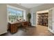 Home office with wood desk and built-in shelving at 3064 Virginia Trail Ct, Fort Mill, SC 29715