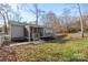 Backyard with wood deck, screened-in porch, lawn and perimeter fencing at 3433 Spinner Ct, Sherrills Ford, NC 28673