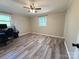 Spacious bedroom with hardwood floors and large window at 3654 Lynwood Dr, Lancaster, SC 29720