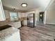 Renovated kitchen featuring white cabinets, stainless steel appliances, and granite countertops at 3654 Lynwood Dr, Lancaster, SC 29720