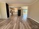 Open living room with kitchen view, and wood-look floors at 3654 Lynwood Dr, Lancaster, SC 29720