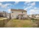 Spacious fenced backyard featuring a charming pergola and well-maintained lawn at 4008 Saphire Ln, Indian Trail, NC 28079