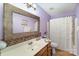 Charming bathroom with decorative mirror and vanity featuring neutral toned decor at 4008 Saphire Ln, Indian Trail, NC 28079