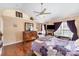 A well-lit bedroom with hardwood floors, ceiling fan, and neutral paint at 4008 Saphire Ln, Indian Trail, NC 28079