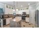 Bright kitchen featuring white cabinets, stainless steel appliances, and island at 4008 Saphire Ln, Indian Trail, NC 28079