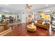 Spacious living room featuring hardwood floors, modern furnishings and access to the kitchen at 4008 Saphire Ln, Indian Trail, NC 28079