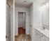 A bathroom with tile flooring, a single sink vanity, and a glass enclosed shower at 4031 Lawnview Dr, Charlotte, NC 28269