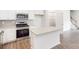 Modern kitchen features a granite island, stainless steel appliances, and ample cabinet space at 4031 Lawnview Dr, Charlotte, NC 28269