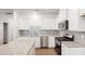 Well-lit kitchen featuring stainless appliances, granite counters and white cabinets at 4031 Lawnview Dr, Charlotte, NC 28269