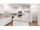 Bright kitchen with white cabinetry, granite countertops, and stainless steel appliances at 4031 Lawnview Dr, Charlotte, NC 28269