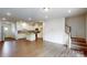 Spacious living room with hardwood floors, staircase, and plenty of natural light at 4031 Lawnview Dr, Charlotte, NC 28269