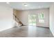 Bright and spacious living room with hardwood floors and sliding glass doors to the backyard at 4031 Lawnview Dr, Charlotte, NC 28269