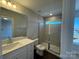 Modern bathroom with a glass-enclosed shower and white vanity at 5548 Stafford Rd # 29, Charlotte, NC 28215