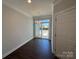 Cozy dining area with a modern light fixture and sliding glass doors to the outside at 5548 Stafford Rd # 29, Charlotte, NC 28215