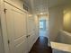 Upstairs hallway with a view into a bedroom and storage closet at 5548 Stafford Rd # 29, Charlotte, NC 28215