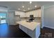 Stylish kitchen with white cabinetry, quartz countertops, and stainless steel appliances at 5548 Stafford Rd # 29, Charlotte, NC 28215