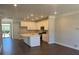 Bright, modern kitchen featuring white cabinets, a center island, and stainless steel appliances at 5548 Stafford Rd # 29, Charlotte, NC 28215