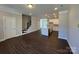 Spacious living room with stairs and a modern kitchen in the background at 5548 Stafford Rd # 29, Charlotte, NC 28215