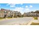 Street view showcasing attractive exterior townhome elevations with manicured lawns, sidewalks, and convenient parking at 5548 Stafford Rd # 29, Charlotte, NC 28215