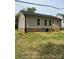 Exterior view of a house with a grassy backyard at 718 Park Ave, Salisbury, NC 28144