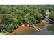 Aerial view of lakeside property with private dock and lush trees at 800 Lakeview Shores Loop, Mooresville, NC 28117